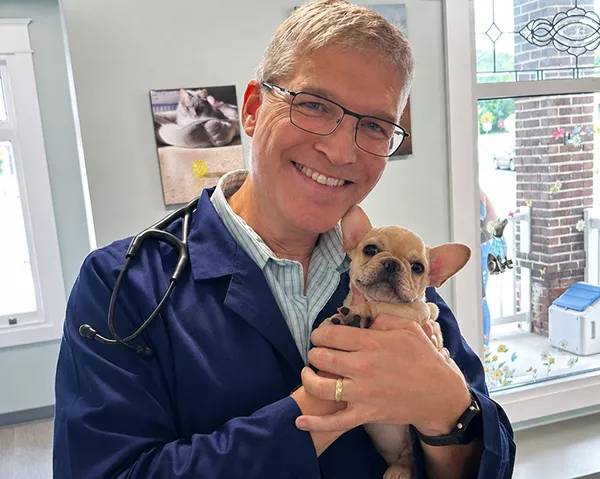 Dr. Daniel Smith holding a cute dog